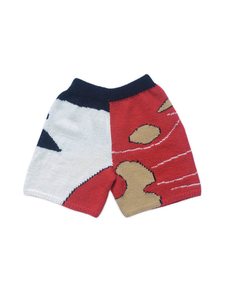 Back of wool bermudas on white background. Red, white, beige and black colour block patterns decorate the bermuda shorts.
