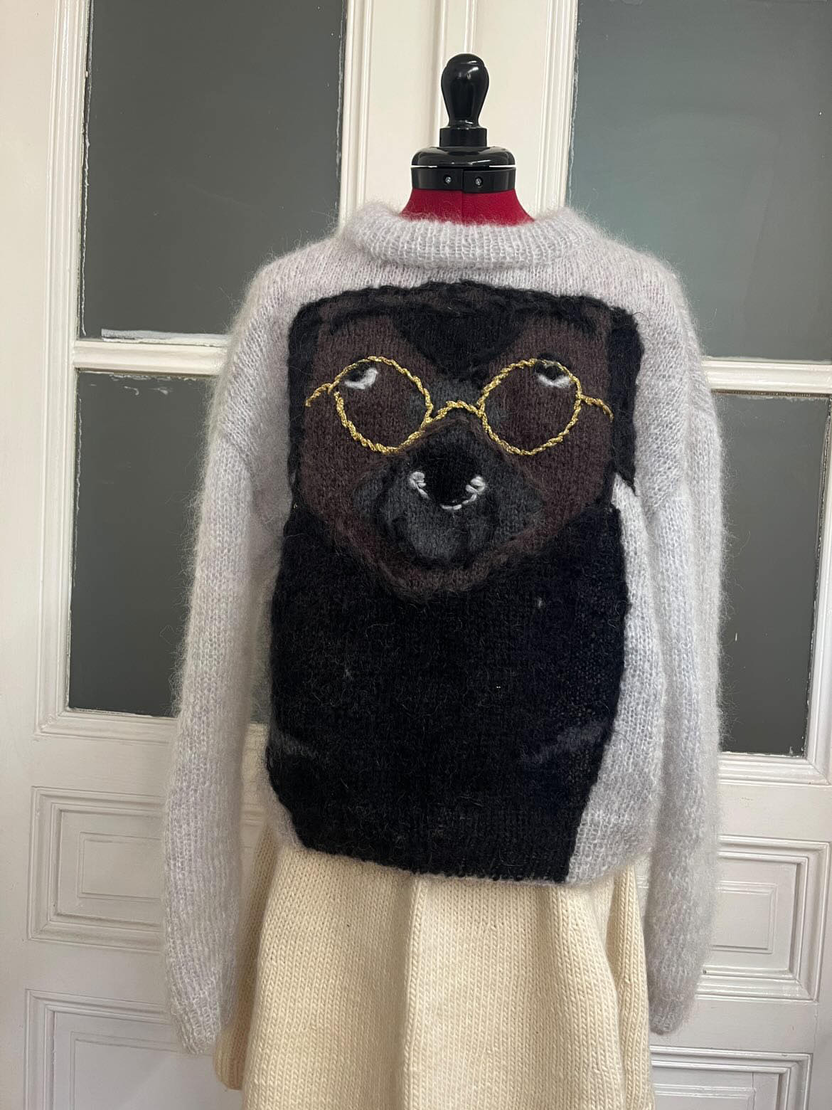 Dog with glasses sweater