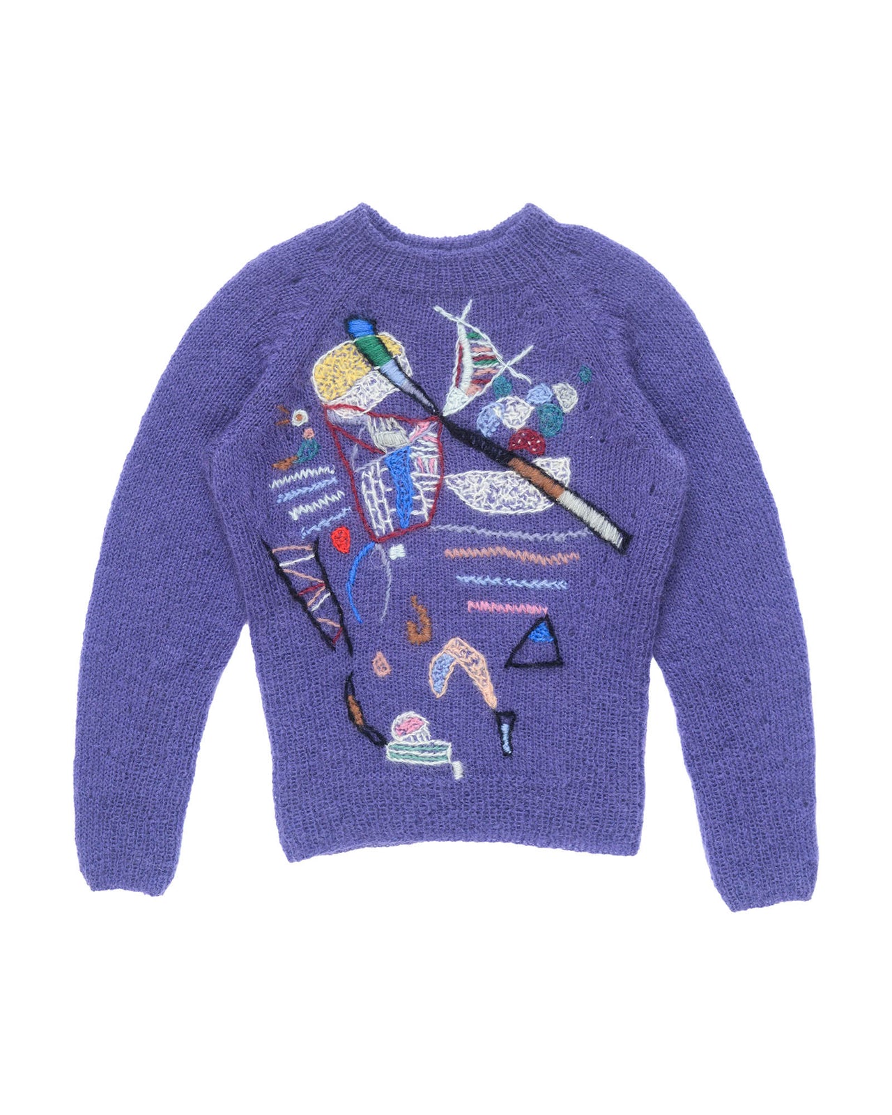 Purple mohair sweater laid flat on white background. The sweater has colourful abstract motifs embroidered over it. 