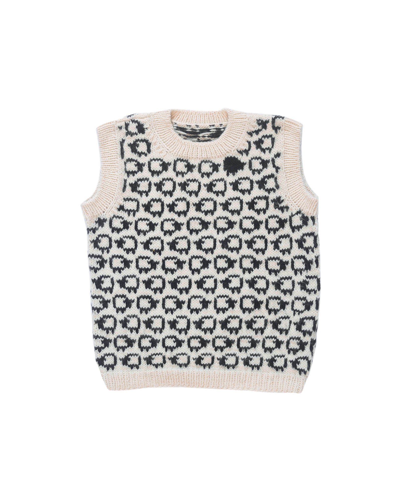 Wool vest laid flat on white background. The vest has a herd of white sheep going all around it, there is one single black sheep lost in the herd. 